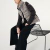 Quilted bouclé jacket with drawstring at the bottom