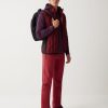 Down-padded gilet with softshell inserts