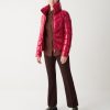 Down jacket with high collar in shiny fabric