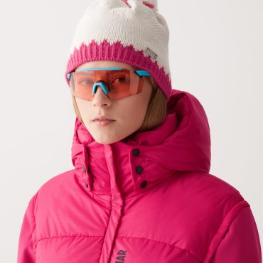 Hat with contrasting trim and pom-pom