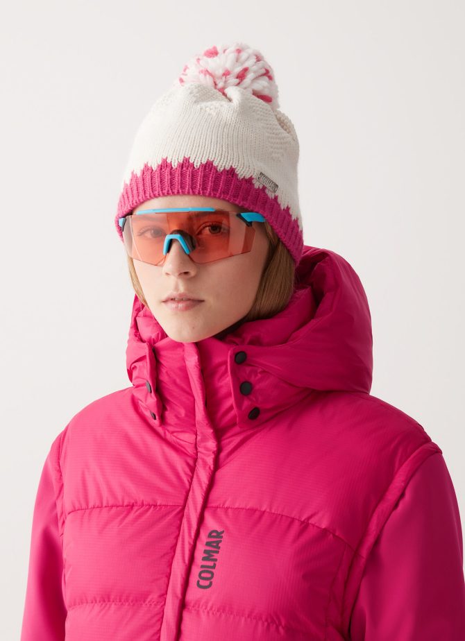 Hat with contrasting trim and pom-pom